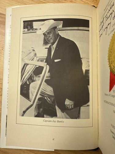 SIGNED Cast a long shadow: Biographical sketch of Captain E.J. (Jay) Banks